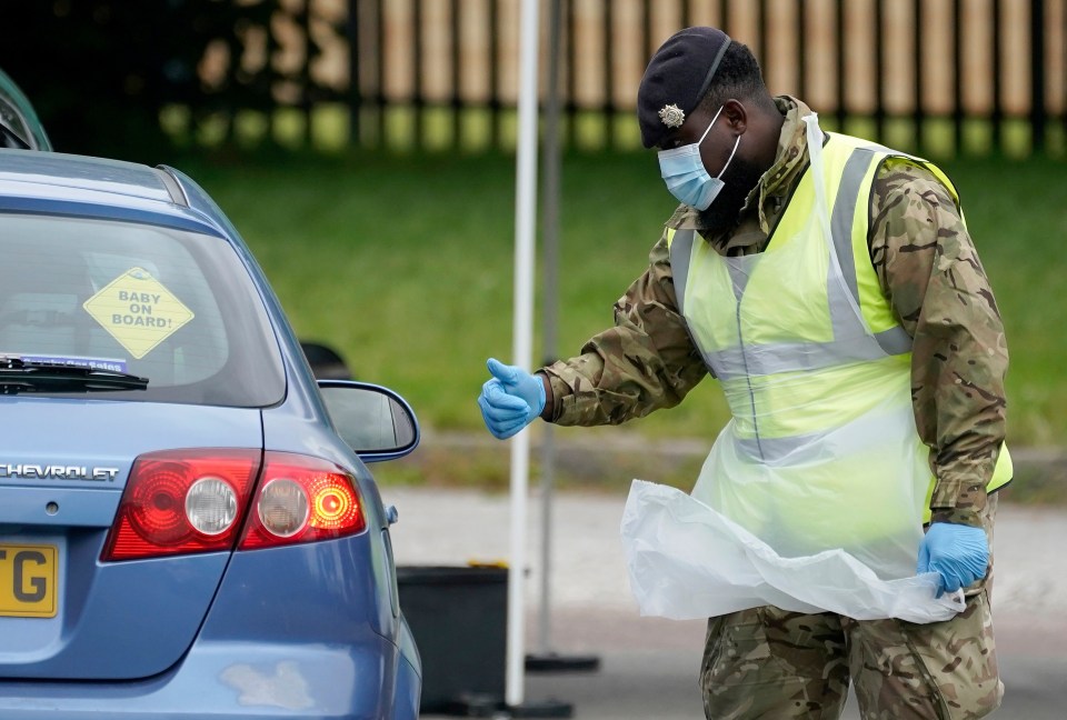 A soldier at a mobile coronavirus testing site at Evington Leisure Centre