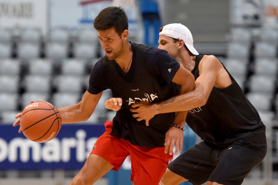  Djokovic and Bulgaria's Grigor Dimitrov playing basketball during the tour