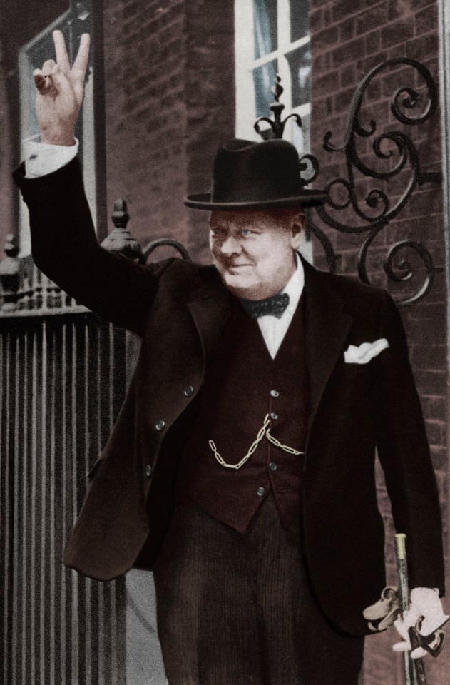 Winston Churchill giving his famous victory sign to crowds