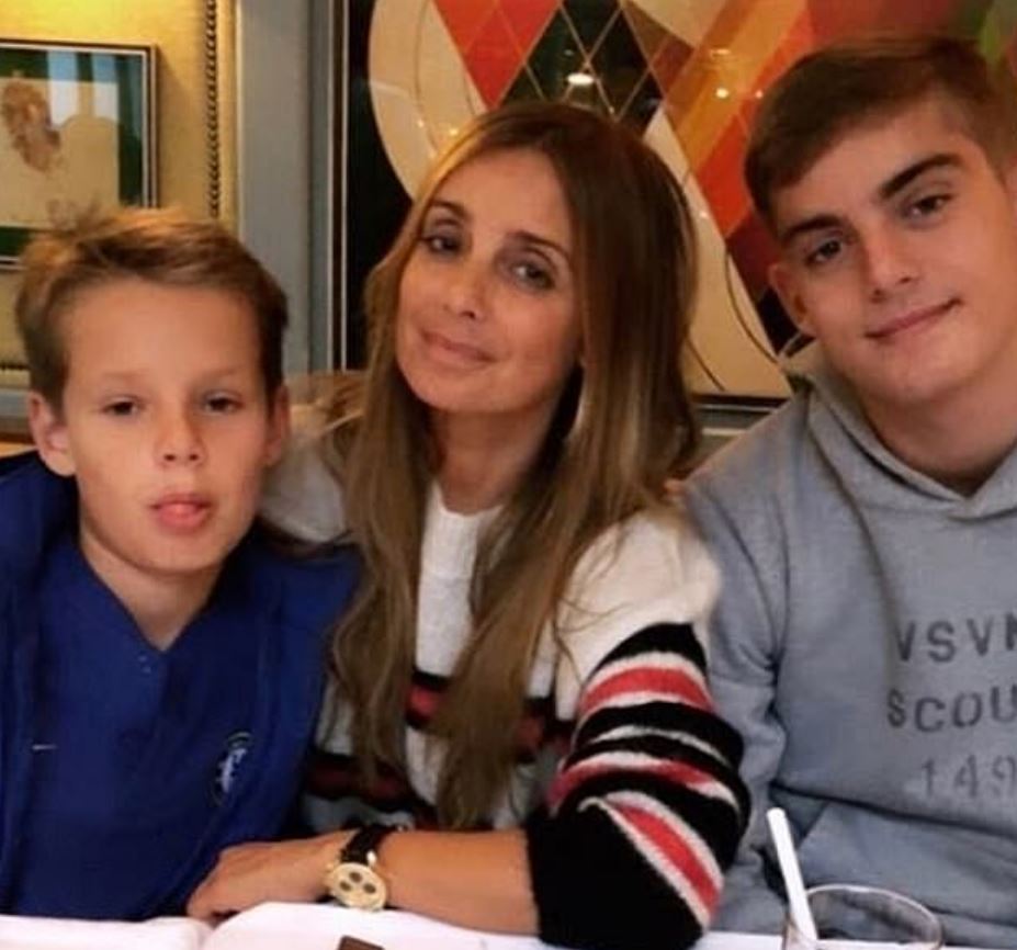 Louise, , 45, pictured with sons Charley, 15, and Beau, 11