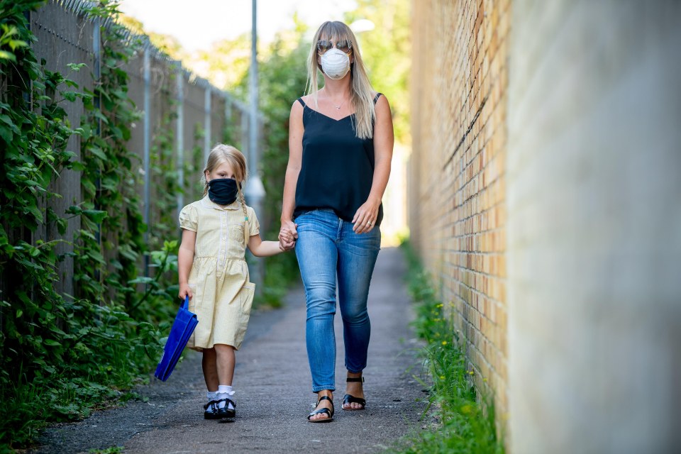  Bowie Cool, aged four, is returning to school today - seen here walking to class with mum Lozzie Cool, from Shoreham-by-Sea, West Sussex