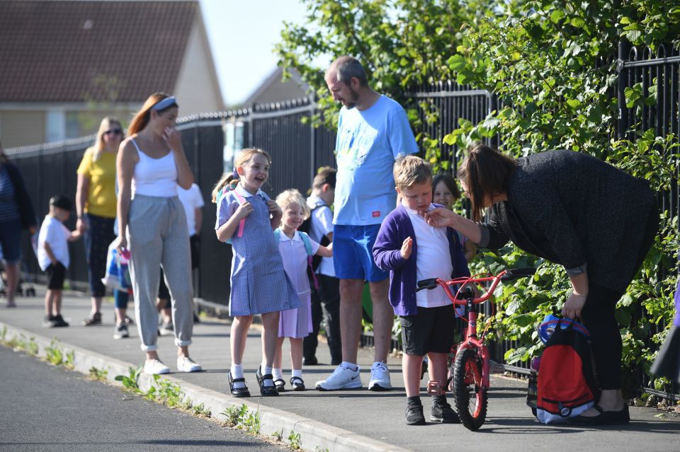  Parents walked to school with their smiling little ones to get back to class