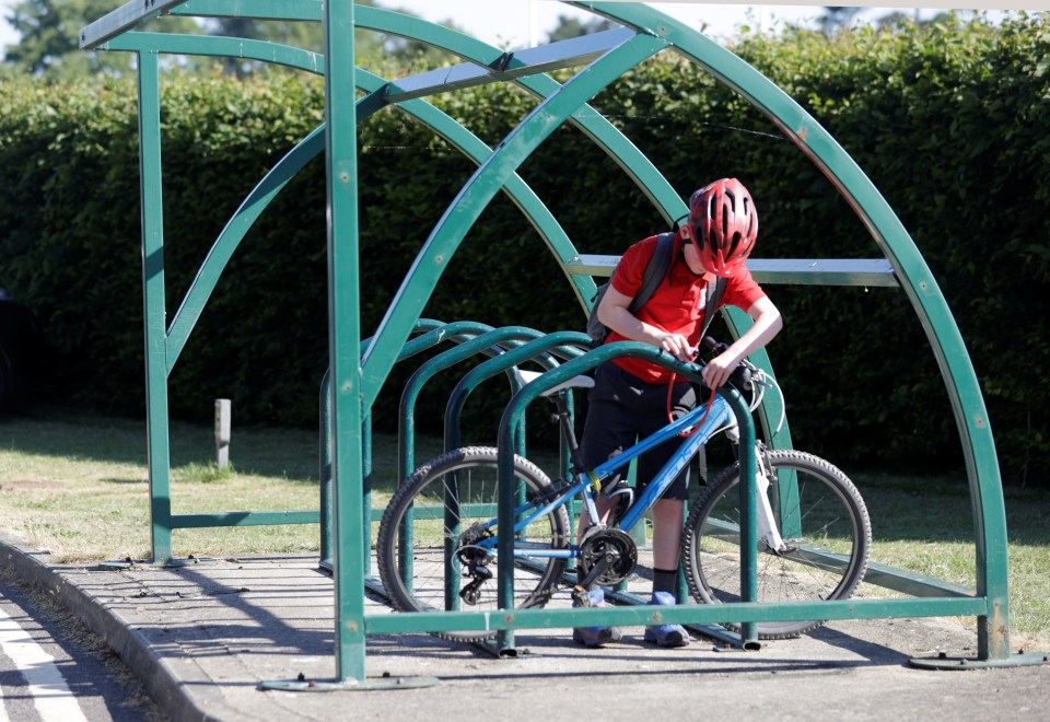  Another youngster locks up his bike to get to class