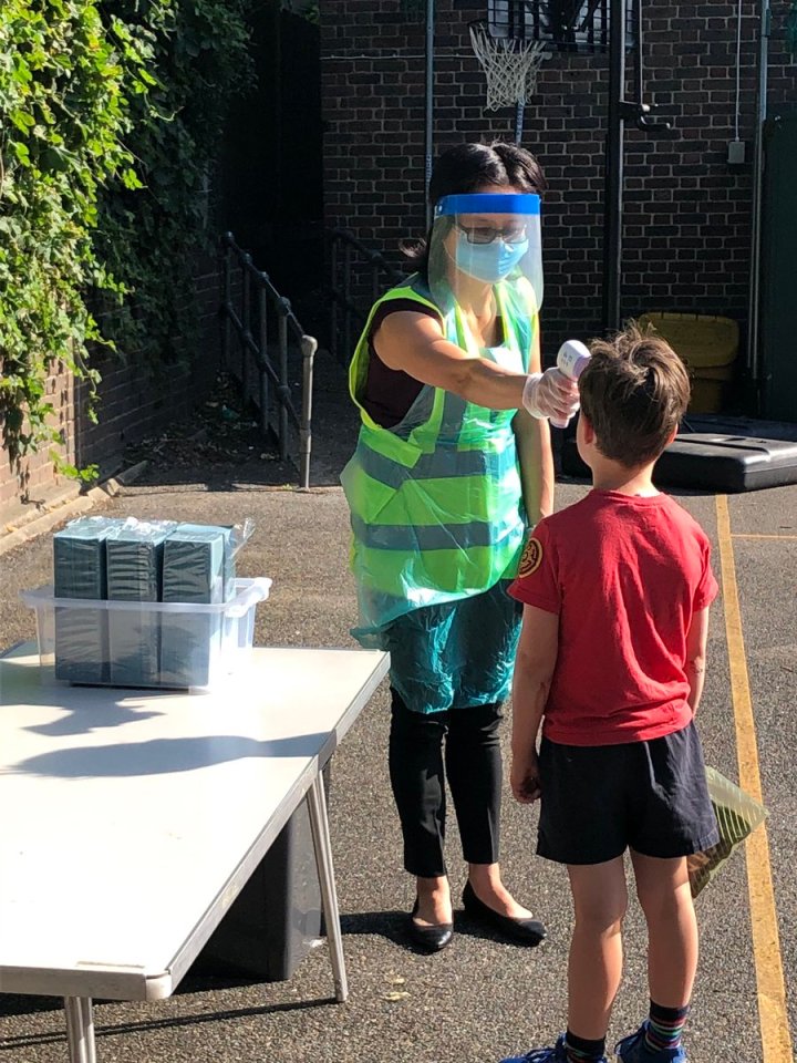  Students have their temperatures checked at Harris Primary Academy