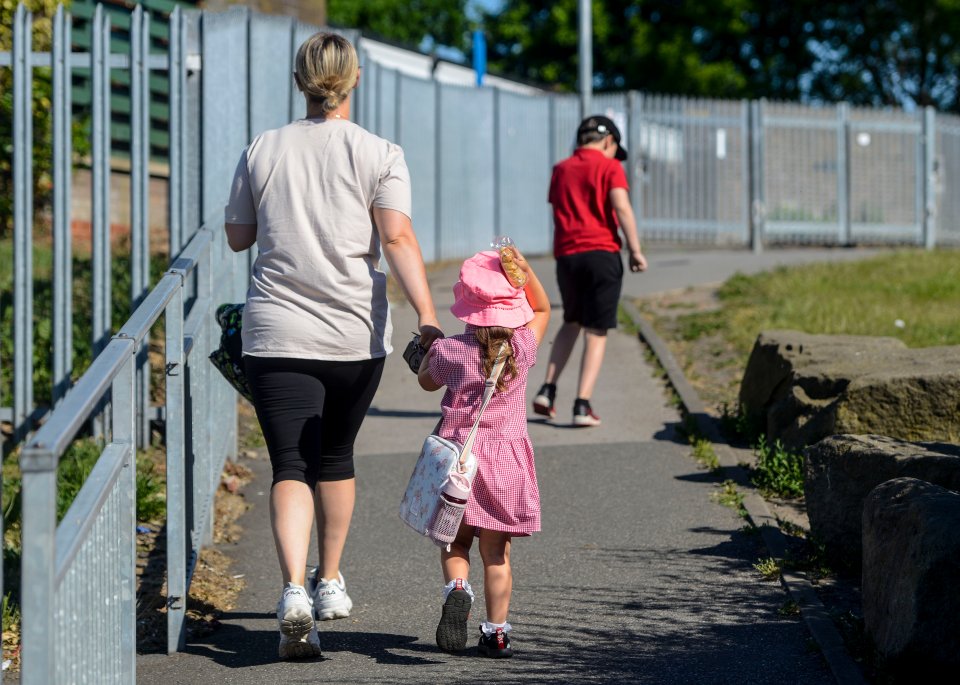  A little girl heads to Beeston Primary School in Leeds, West Yorkshire