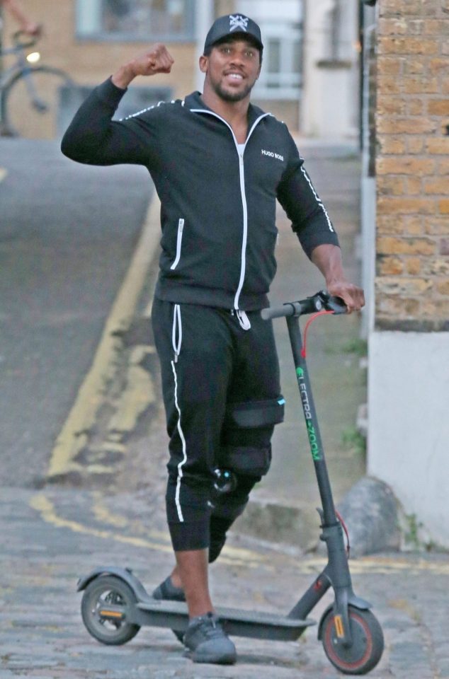  Anthony Joshua looked to be having a great time as ventured out on a scooter with pals while wearing a big leg brace