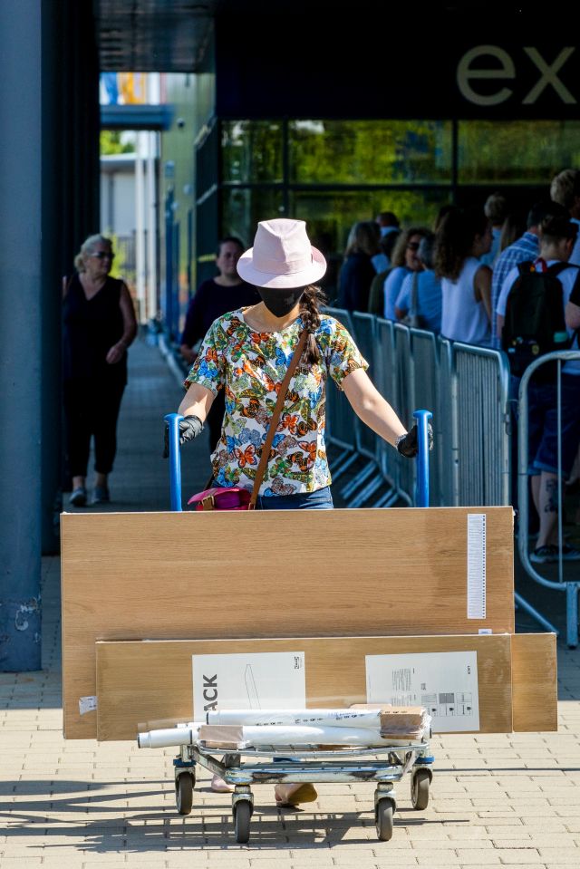 Another shopper leaving an Ikea store with their new items