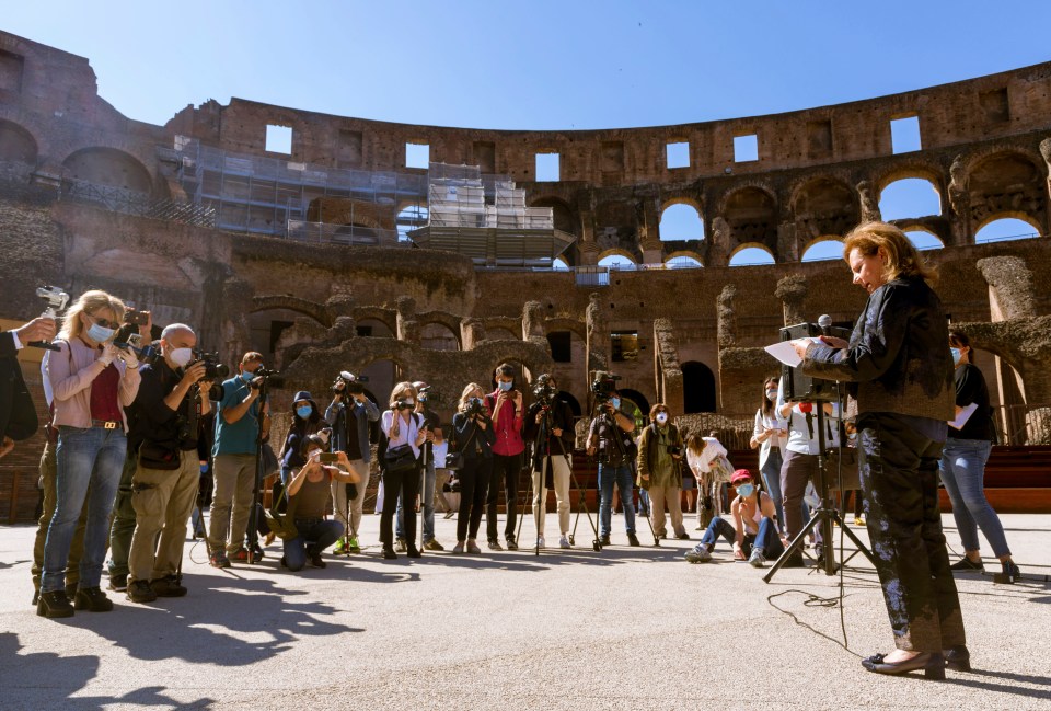  Alfonsina Russo, right, director of the Colosseum Archaeological Park, speaks to media inside the Colosseum in Rome on Monday to announce its reopening to the public