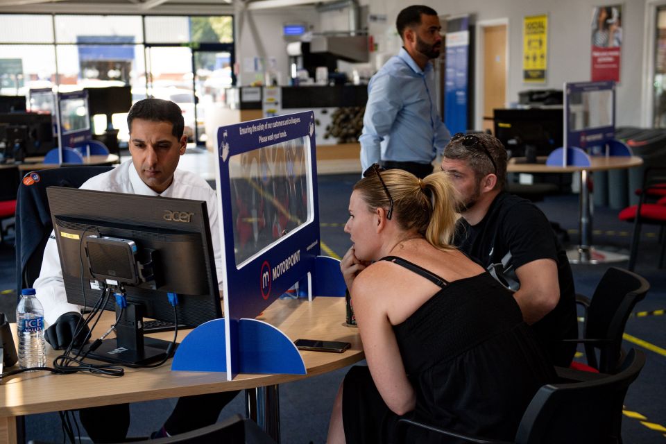 Pictures show staff and customers separated by screens 