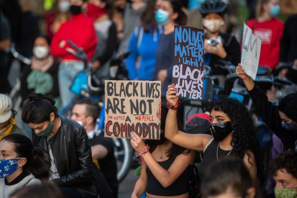  People attend a silent vigil in McCarren Park to support the Black Lives Matter movement in Brooklyn, New York