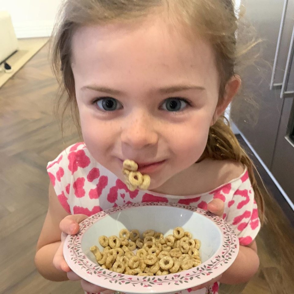 Liberty had Cheerios stuck to her face in this snap