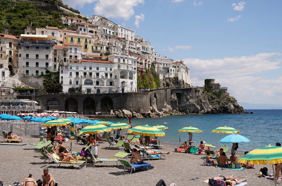  Tourists flock to an Amalfi beach on Tuesday as hotels and businesses begin to reopen