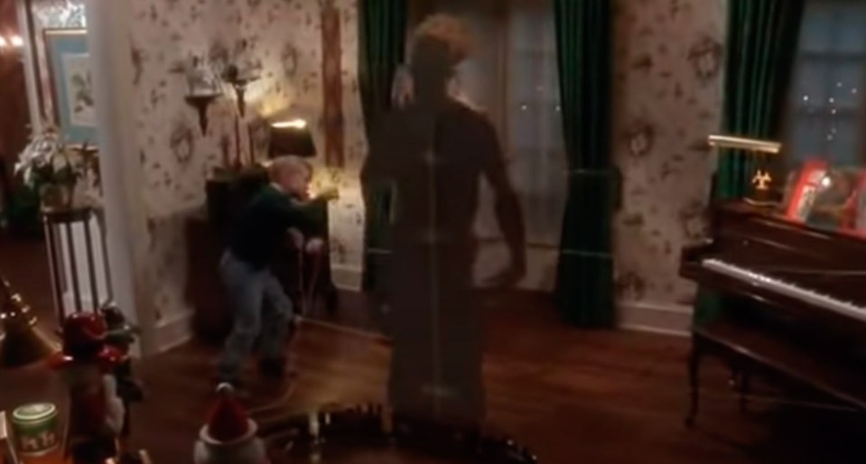  Still of actor Macaulay Culkin with cardboard cutouts in cult classic Home Alone