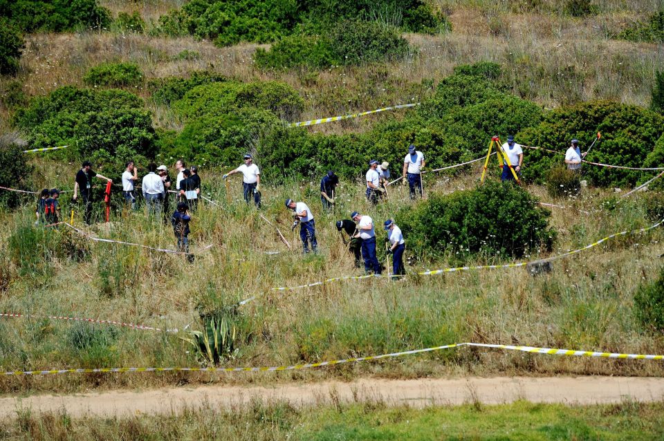 Search teams scouring grass near the holiday complex in Portugal in 2007