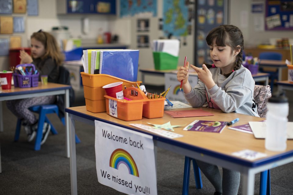  Children are pictured social distancing during a lesson at a London school on June 4. While some schools across the UK have reopened, many remain closed to the majority of students