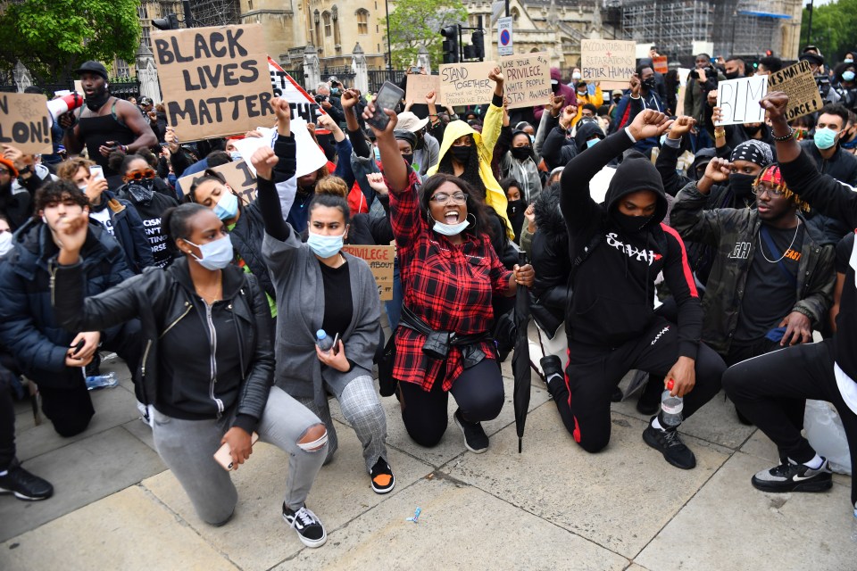 Protesters take a knee against the death of George Floyd in London