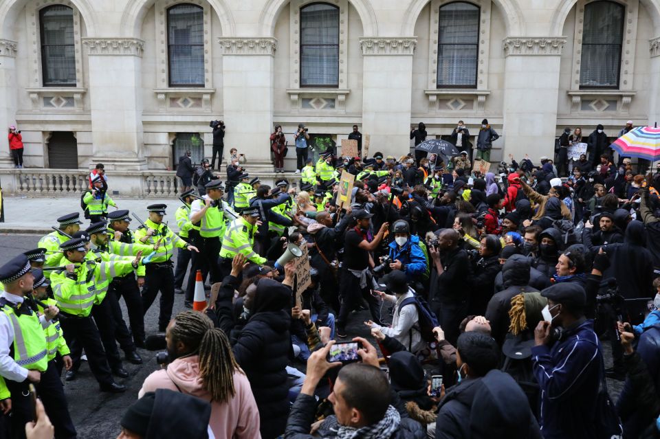 Police clash with protesters in Westminster, London