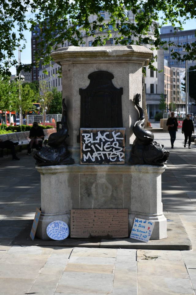 The plinth where the Colston statue was erected is left empty with Black Lives Matter graffitti daubed on it