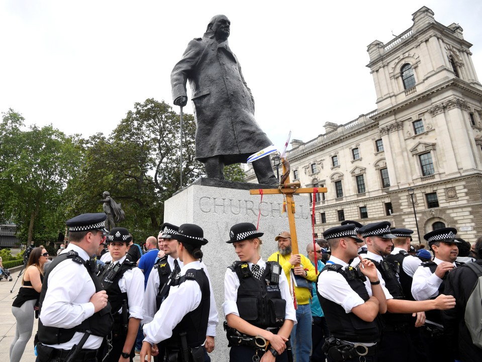 Police were seen standing around the statue of Winston Churchill earlier this week