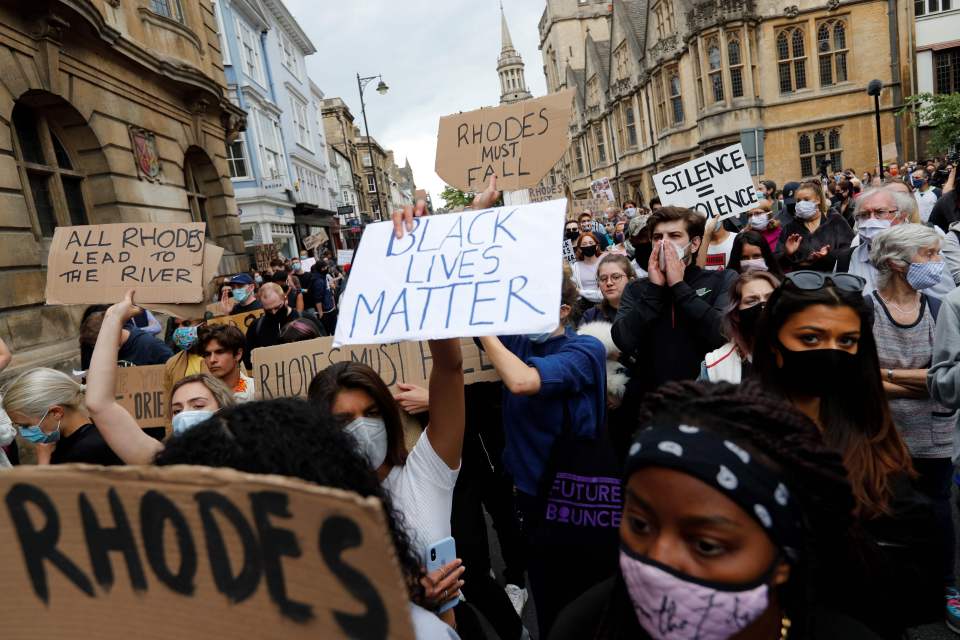 Protesters gathered outside Oriel College, Oxford, to demand the Cecil Rhodes statue be removed