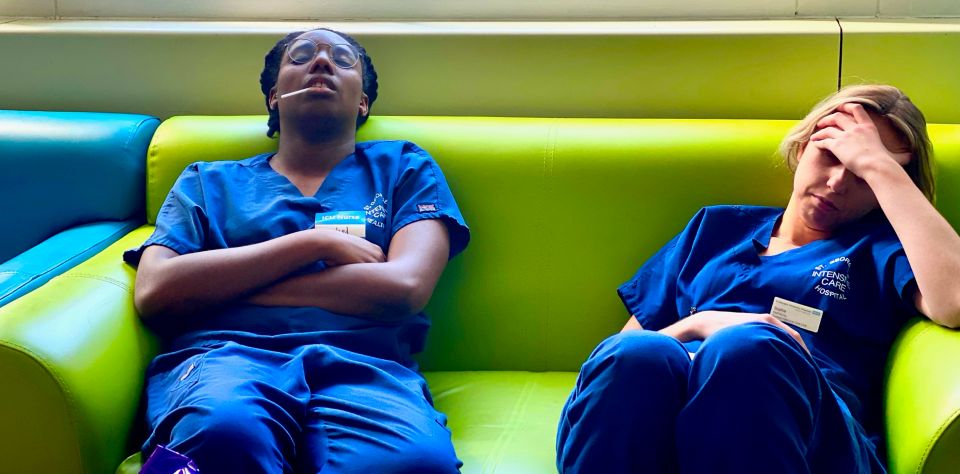 Another image shows two nurses sleeping after a long shift 