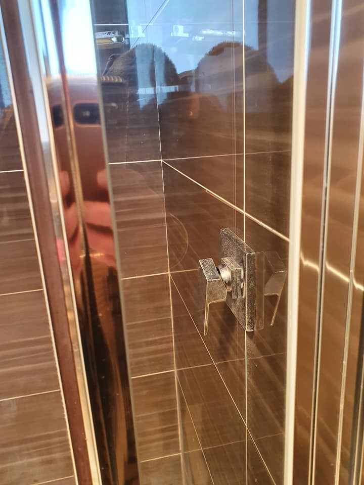 The shower screen in squeaky clean