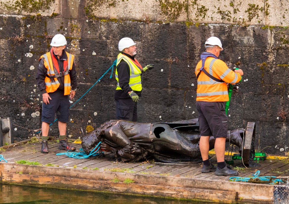 The statue is seen here just after being pulled out of the water