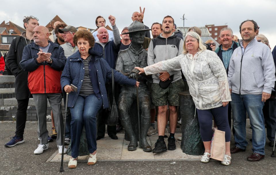 Former Scouts formed a human shield around the statue in Dorset