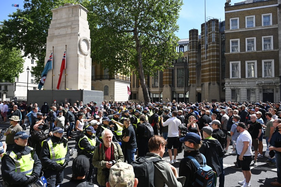 Police surround a group of protesters guarding the Cenotaph