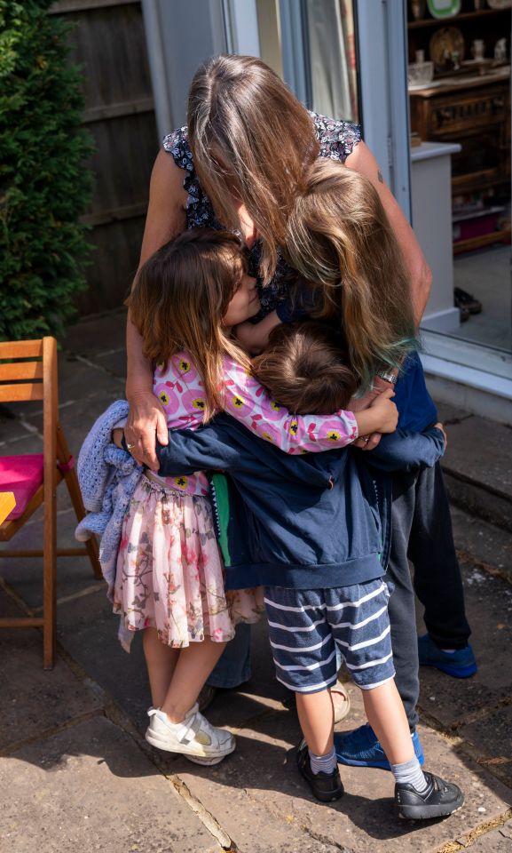  Susan reunited with her grandchildren Emily (centre) and Daisy (right), in Ashtead, Surrey