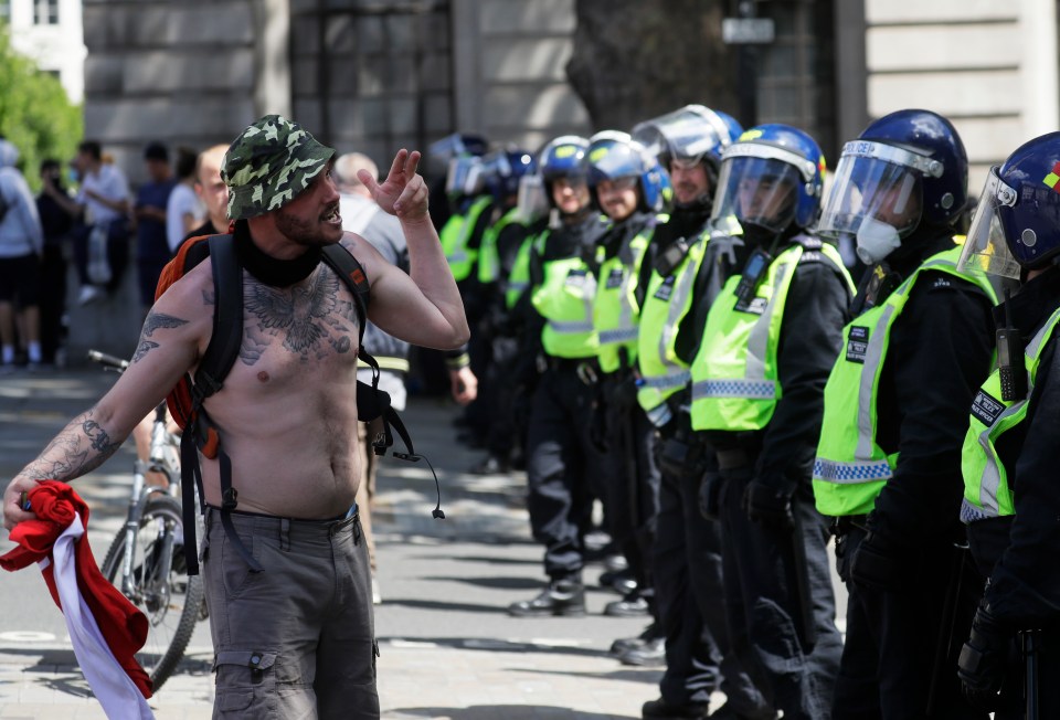  Protesters have been"protecting" the Cenotaph by hurling fireworks and glass bottles at police