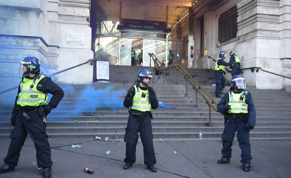 Smoke bombs were let off at Waterloo Station as both groups tried to break through police lines