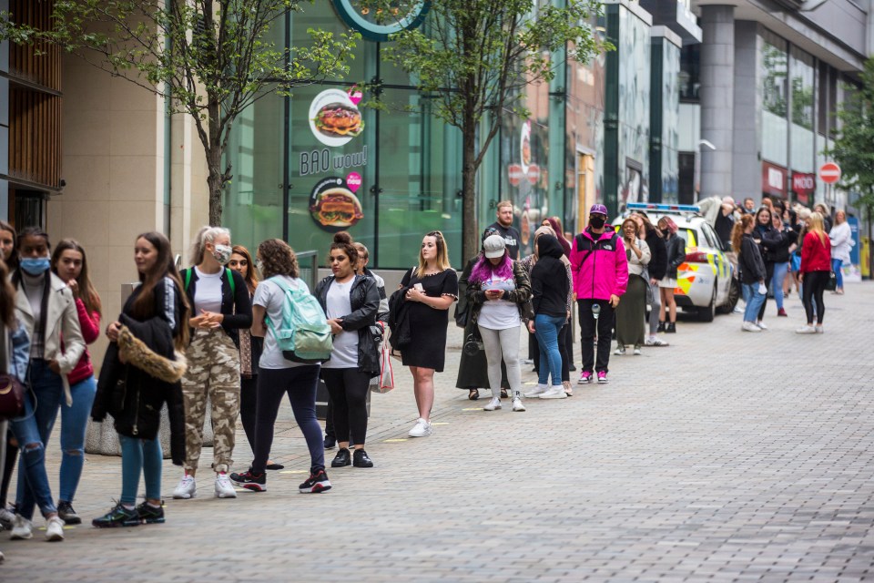 Customers outside the Trinity shopping centre in Leeds