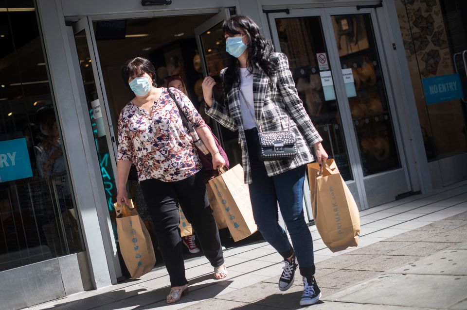 Shoppers leaving Primark in Oxford Circus with their goods