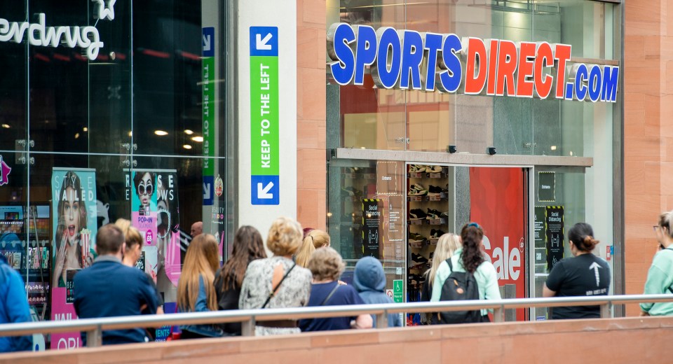 Shoppers waiting outside Sports Direct in Liverpool