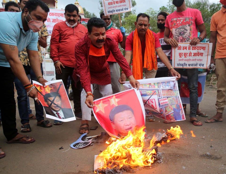 Protesters burn images of president Xi Jinping after Indian soldiers die fighting Chinese troops