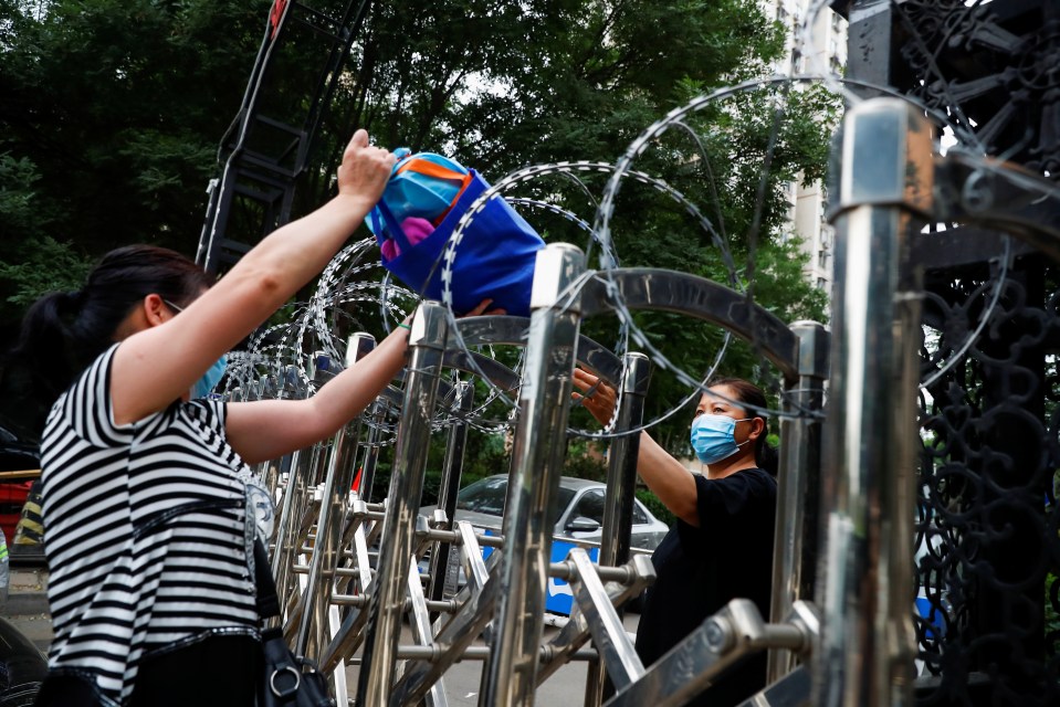 Some residents are being kept inside residential compounds sealed off with razor wire