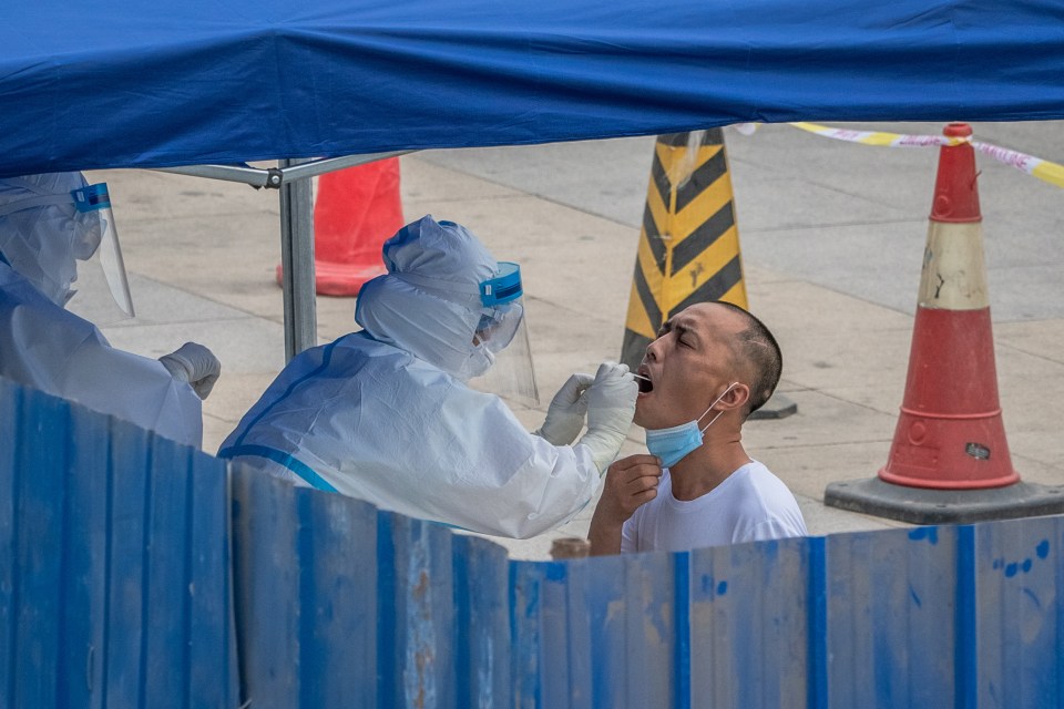 A man is tested for COVID-19 at a makeshift coronavirus testing centre