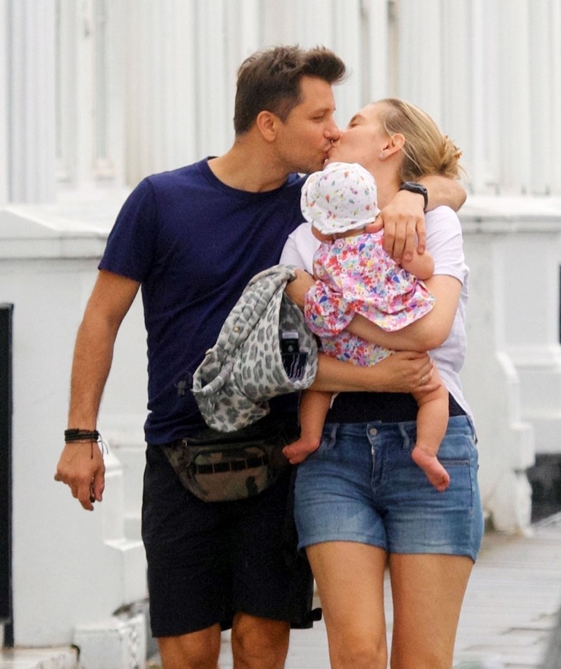 Rachel, 34, puckered up for a smooch with her Strictly Come Dancing hubby, Pasha Kovalev