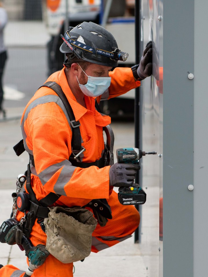 Work began to remove the protection surrounding a number of statues in central London