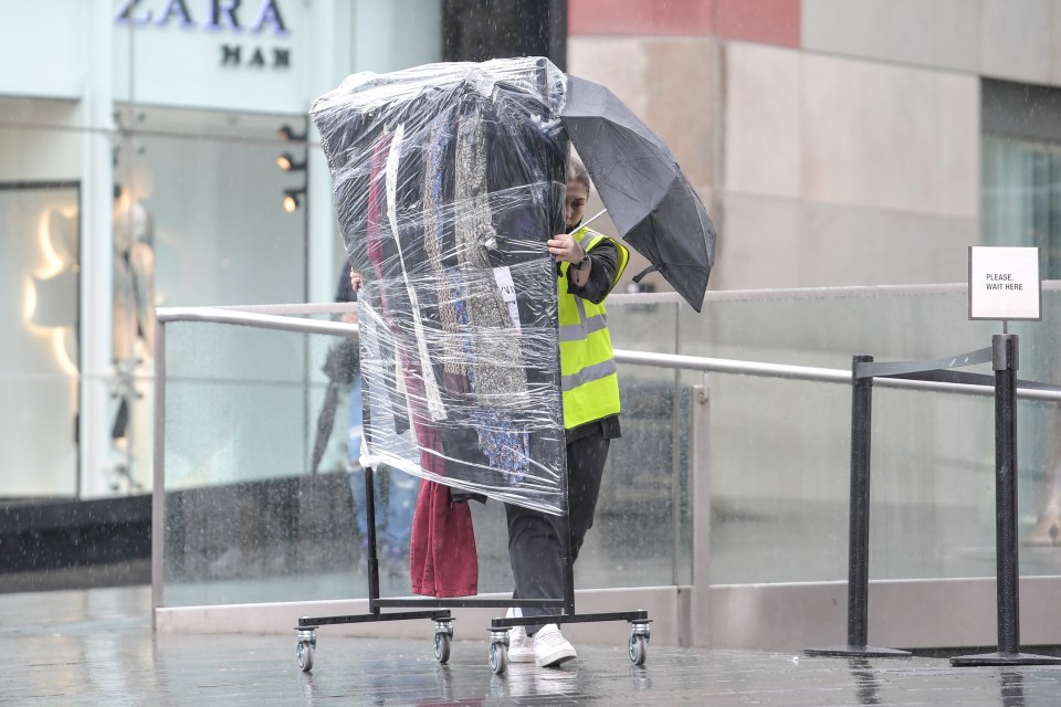  Shoppers and retail workers brave the wet weather in Birmingham city centre