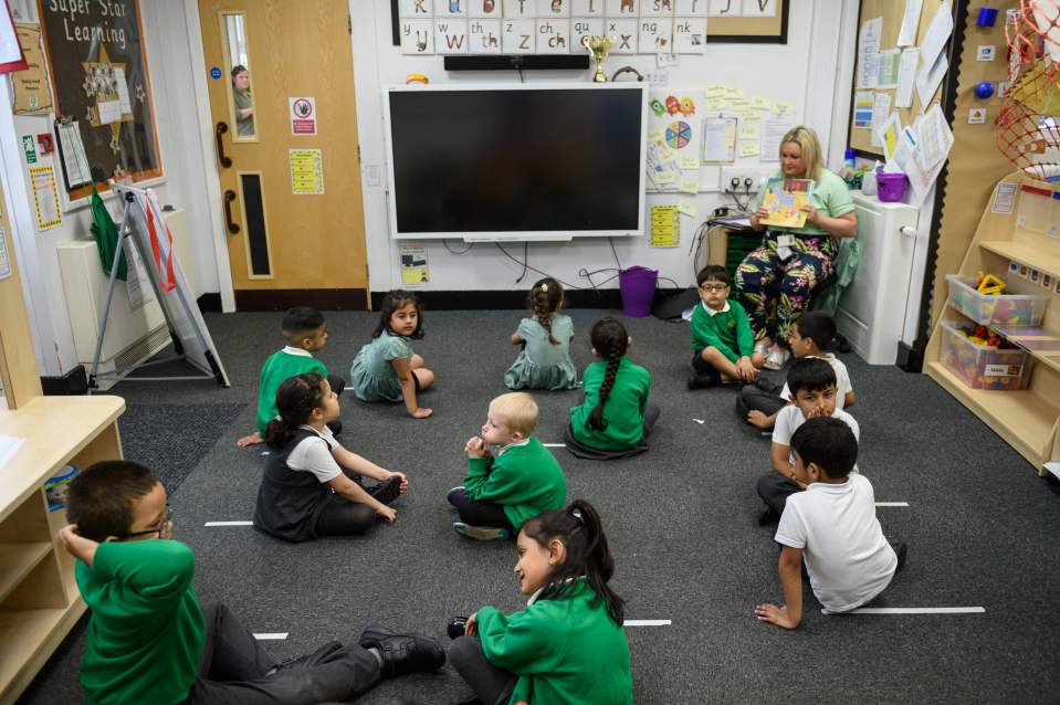 Reception pupils are taught at Greenacres Primary Academy in Oldham, Greater Manchester, with social distancing measures in place