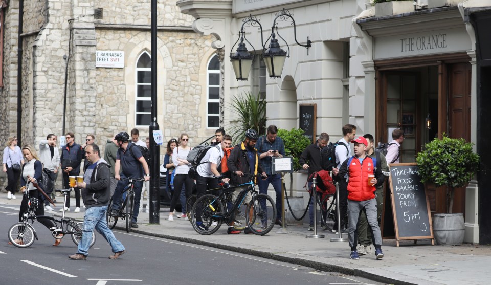 Another London pub saw loyal customers lining up to get a pint to go