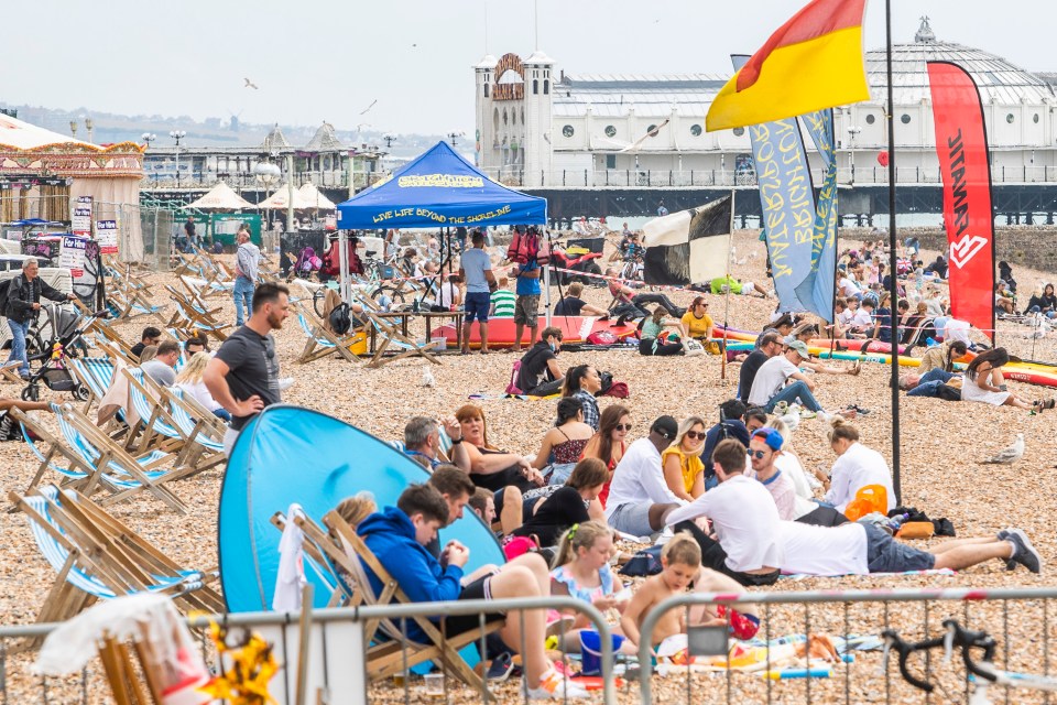 Members of the public take to the beach in Brighton and Hove