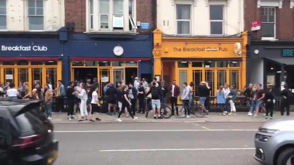 People spotted queuing up to get takeaway pints in Battersea, South London, today