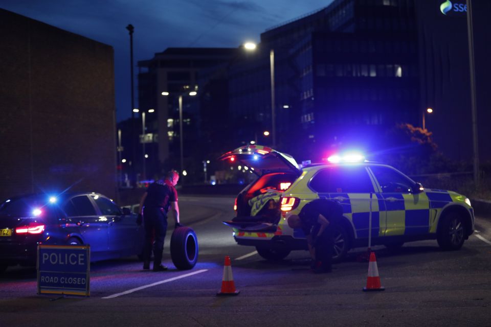 Police arrive on the scene near Forbury Gardens park in Reading, west of London, following the stabbing