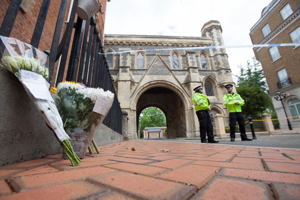 Flowers have been left at the police cordon after the deaths