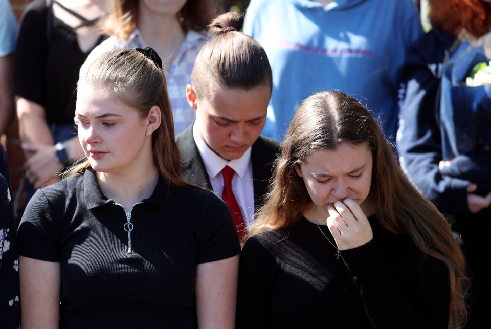  Pupils of teacher James Furlong take part in a period of silence at the Holt School, Wokingham, following his death in Forbury Gardens