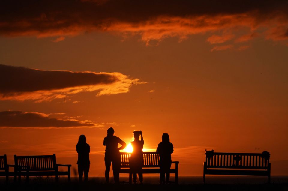 The sun rises at Tynemouth Pier on the North East coast this morning