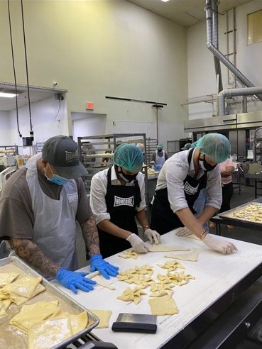 Harry and Meghan wore hairnets and masks to help feed vulnerable people in LA